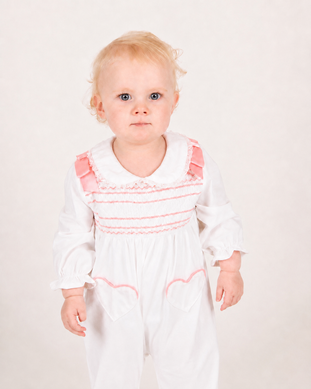Blush Pink Hand-Smocked Babygrow