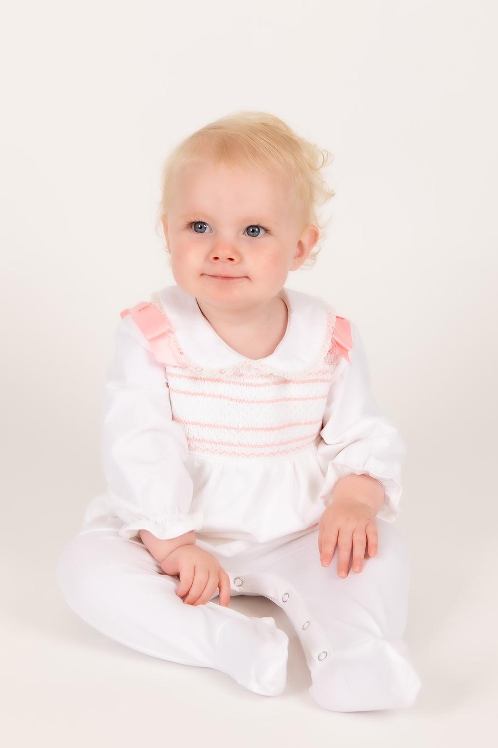 Blush Pink Hand-Smocked Babygrow