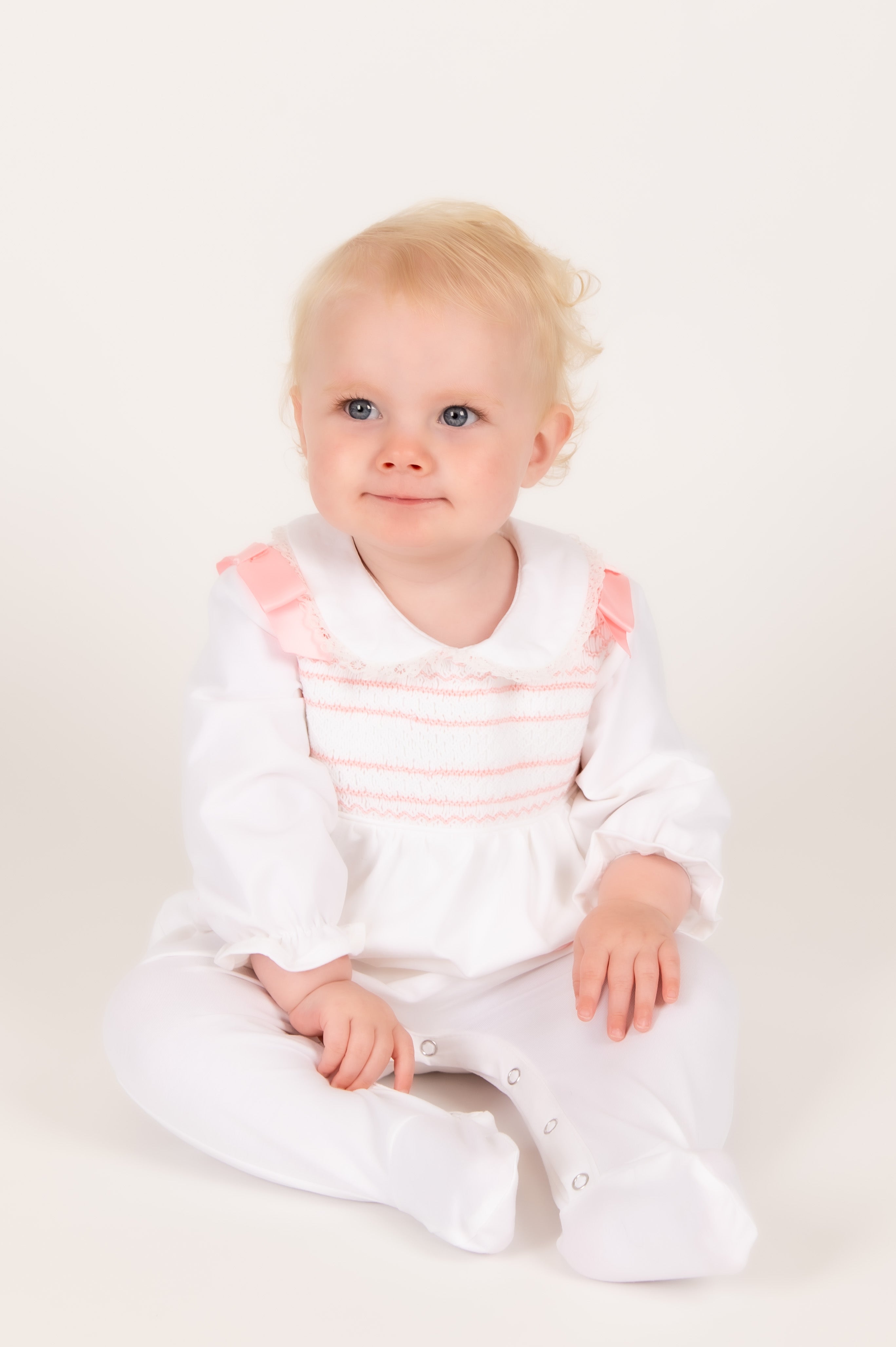 Blush Pink Hand-Smocked Babygrow